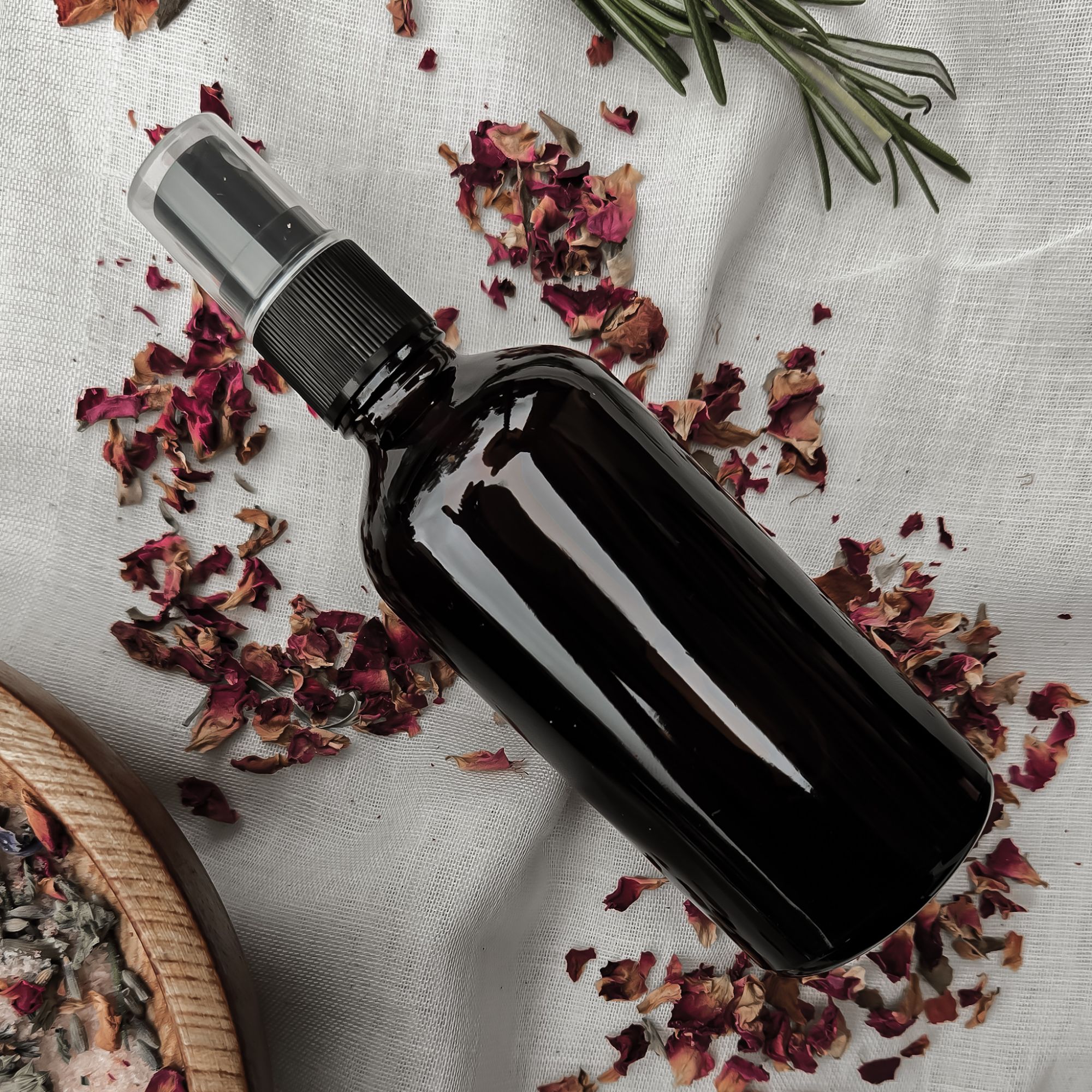 homemade rosewater in an amber spray bottle